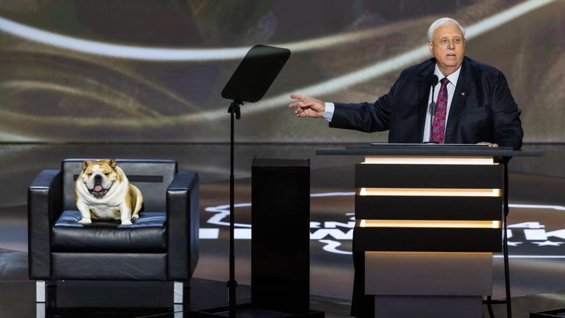 West Virginia’s Republican governor Jim Justice speaks alongside his English bulldog Babydog during the second day of the Republican National Convention.