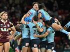 The Blues celebrate their series-clinching Origin triumph over the Maroons in Brisbane. (Darren England/AAP PHOTOS)