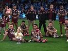 Queensland players look dejected after losing.