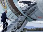 President Joe Biden walks up the steps of Air Force One after testing positive for COVID.