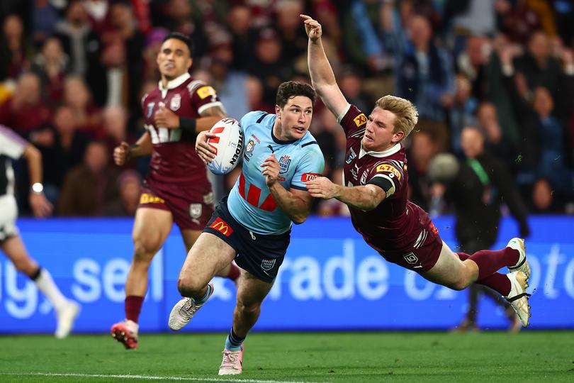 BRISBANE, AUSTRALIA - JULY 17:  Mitchell Moses of the Blues makes a break to score a try during game three of the 2024 Men's State of Origin series between Queensland Maroons and New South Wales Blues at Suncorp Stadium on July 17, 2024 in Brisbane, Australia. (Photo by Chris Hyde/Getty Images)