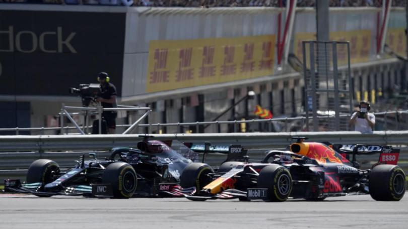 Lewis Hamilton (L) and  Max Verstappen before their collision at the 2021 British Grand Prix