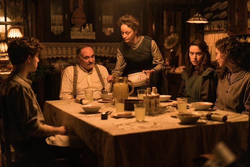 (L-R): Kim Bodnia as Henry Ederle, Jeanette Hain as Gertrud Ederle, Daisy Ridley as Trudy Ederle in Disney's live-action YOUNG WOMAN AND THE SEA. Photo by Elena Nenkova.  2024 Disney Enterprises, Inc. All Rights Reserved.