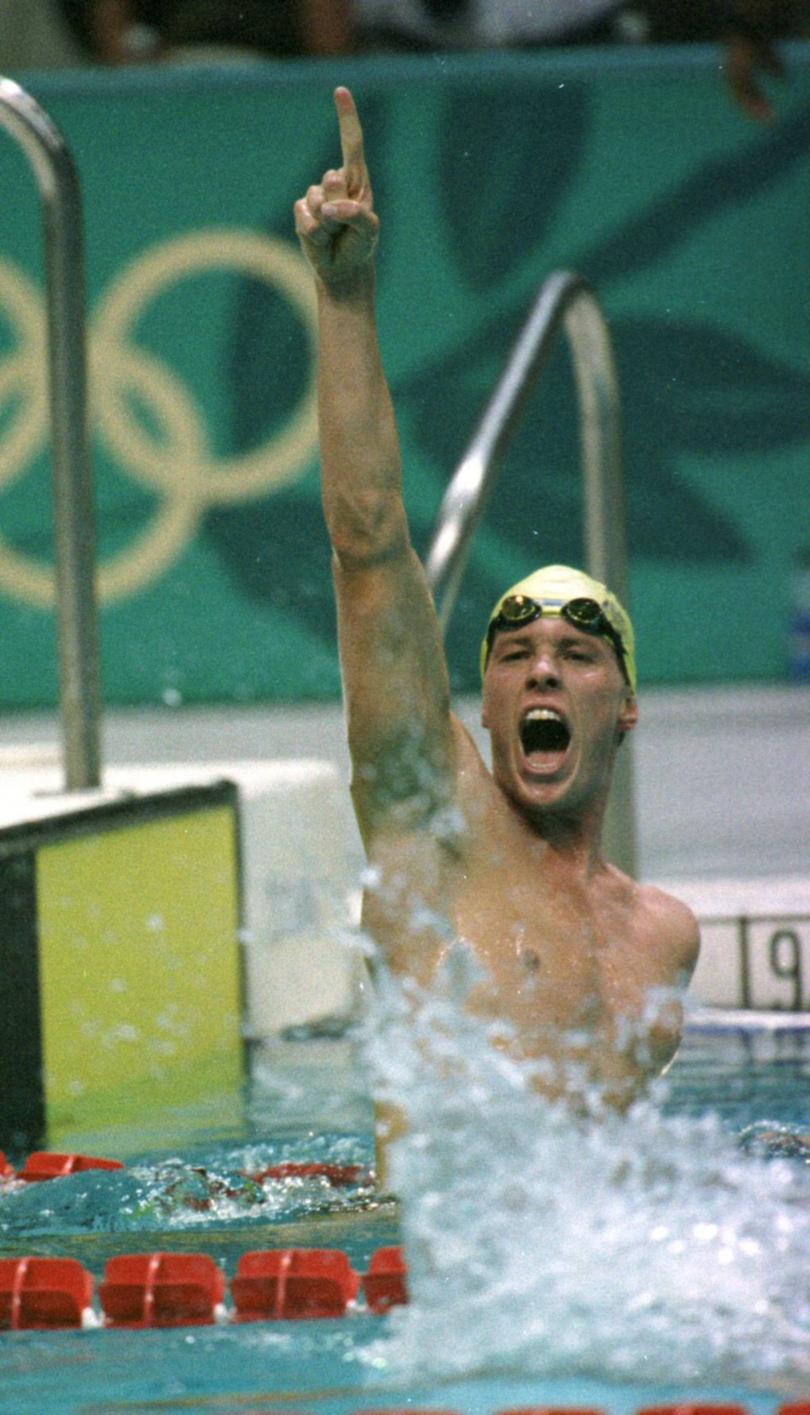 Kieren Perkins declares he is number one by pointing in the air after winning gold in the mens 1500m tonight at the Atlanta 1996 Olympic games.