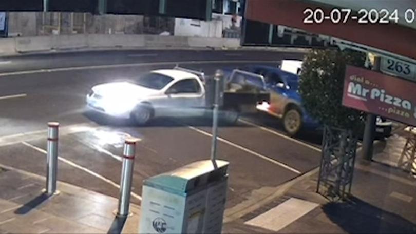 The 39-year-old man can be seen allegedly ramming his boss’ car twice in CCTV footage, as nearby tradies are spotted taking refuge.