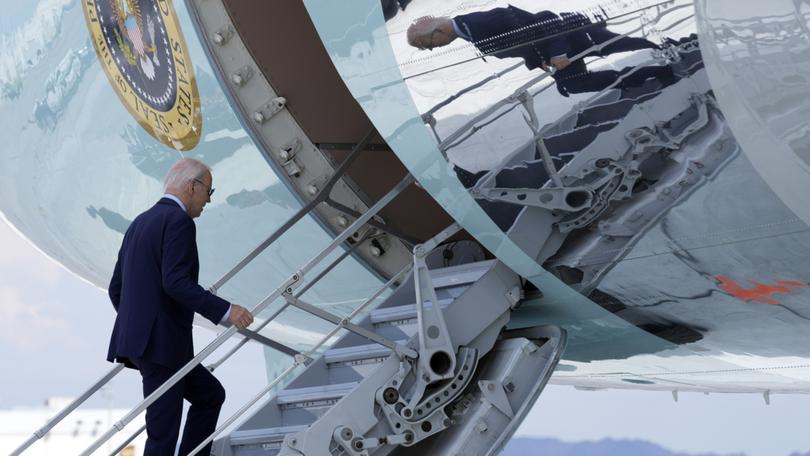 President Joe Biden walks up the steps of Air Force One at Harry Reid International Airport in Las Vegas, Wednesday, July 17, 2024. Biden has tested positive for the coronavirus, according to a speaker at the UnidosUS annual conference broadcast on the White House's YouTube channel. (AP Photo/Susan Walsh)