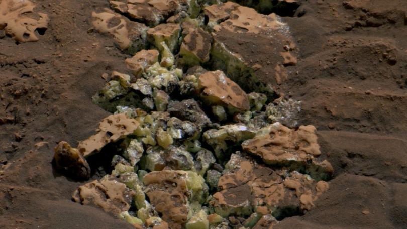 NASA's Curiosity Mars rover viewed these yellow crystals of elemental sulfur using its Mast Camera.