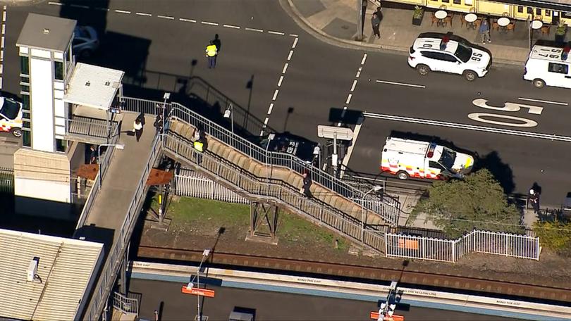 Police officers could hear crying coming from underneath a train after a pram with two children inside rolled in front of its path.