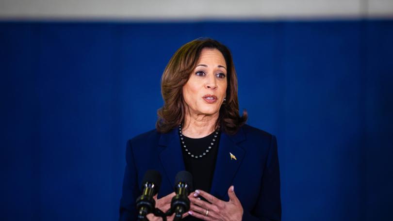 Vice President Kamala Harris speaks to the media about gun safety measures as well as families who hold portraits of the victims of the 2018 shooting at Marjory Stoneman Douglas High School in Parkland, Fla. MUST CREDIT: Saul Martinez for The Washington Post