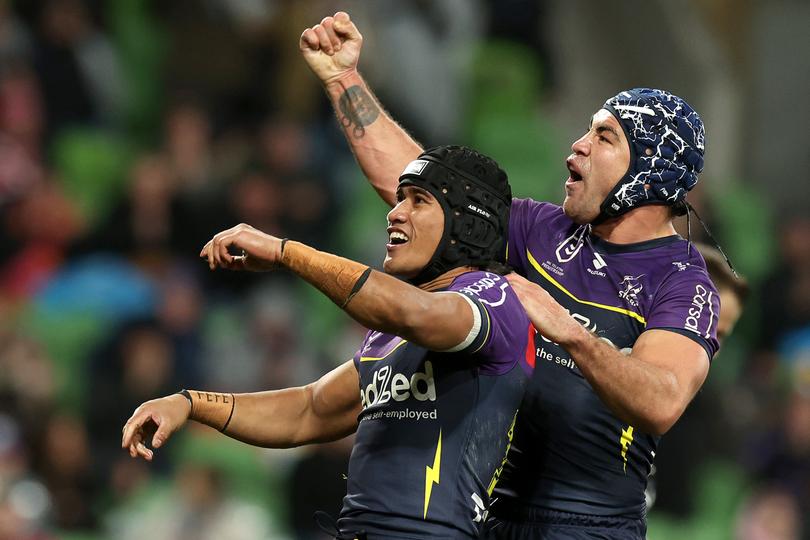 MELBOURNE, AUSTRALIA - JULY 20: Sualauvi Faalogo of the Storm celebrates scoring a try with Jahrome Hughes of the Storm during the round 20 NRL match between Melbourne Storm and Sydney Roosters at AAMI Park, on July 20, 2024, in Melbourne, Australia. (Photo by Kelly Defina/Getty Images)