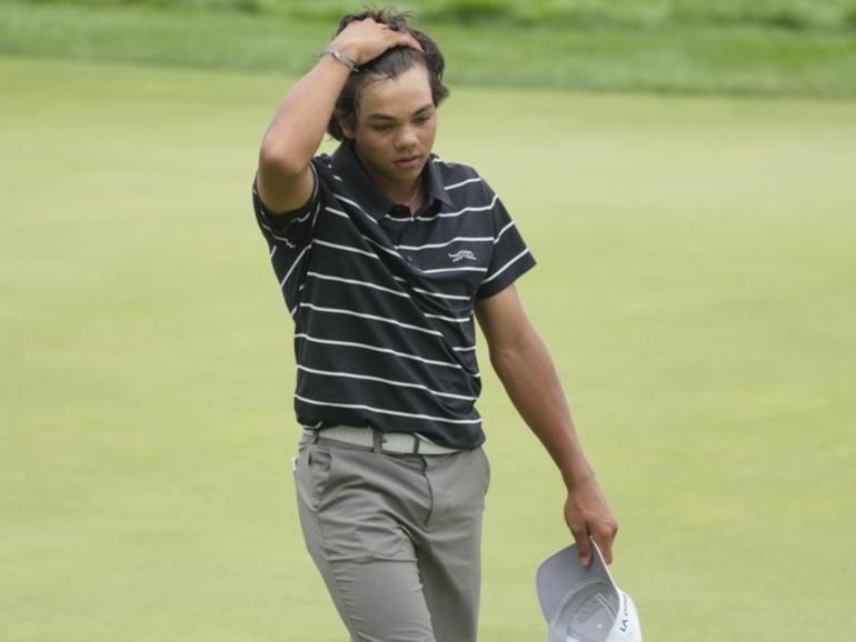 Charlie Woods walks off the 18th green after a tough first US Junior Amateur Championship.