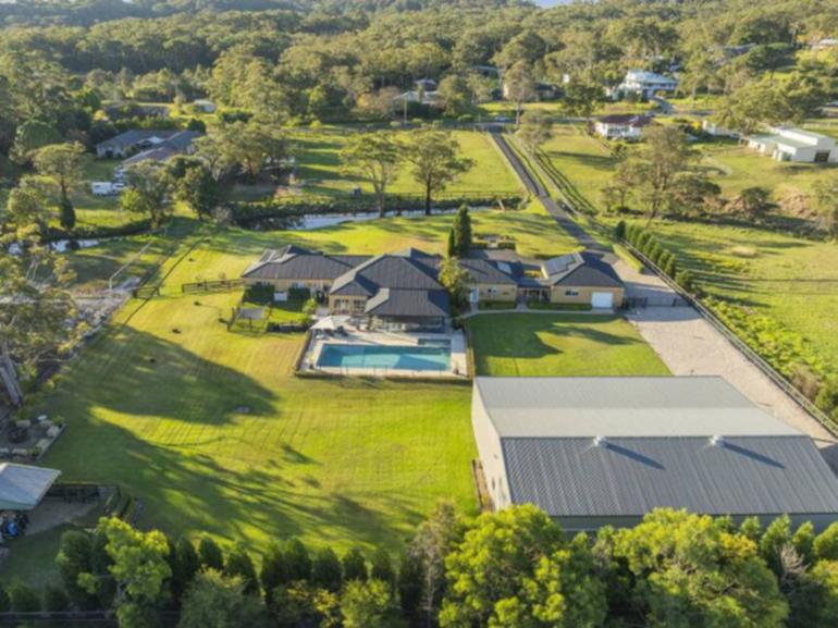 This three-acre property at 8 Casson Avenue in Eleebana is listed with Tess Fearon at Harcourts Newcastle. 