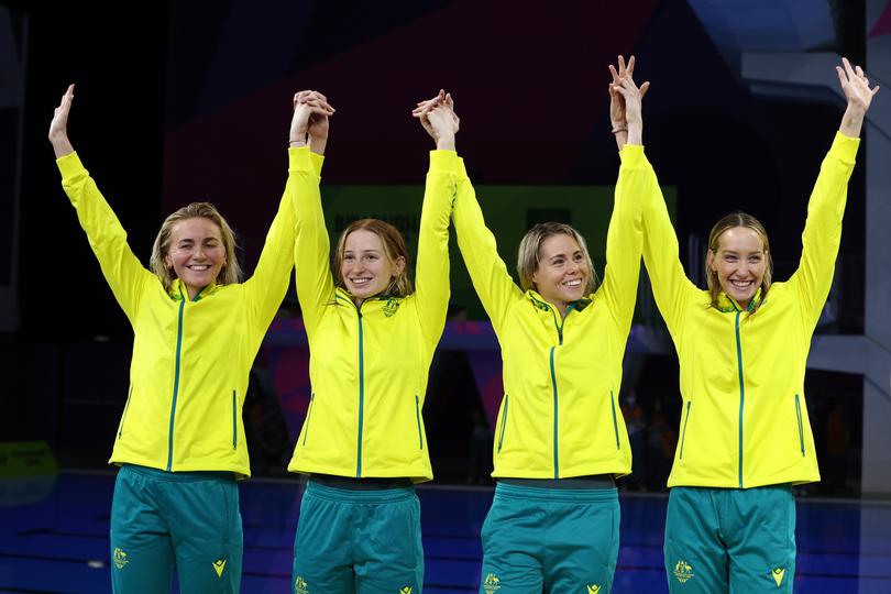 SMETHWICK, ENGLAND - JULY 31: Gold medalists, Madison Wilson, Kiah Melverton, Ariarne Titmus and Mollie O'Callaghan of Team Australia celebrate setting a new World Record during the medal ceremony for the Women's 4x200m Freestyle Relay Final on day three of the Birmingham 2022 Commonwealth Games at Sandwell Aquatics Centre on July 31, 2022 on the Smethwick, England. (Photo by Robert Cianflone/Getty Images)