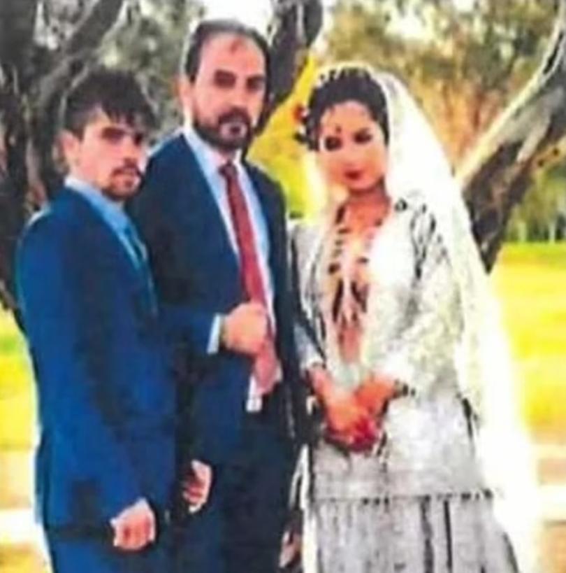 Mohammad Ali Halimi, centre, pictured with Ruqia Haidari, right, on their wedding day in 2019.