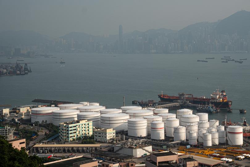 China Petroleum & Chemical Corp. (Sinopec) storage tanks at the container terminal in Hong Kong.