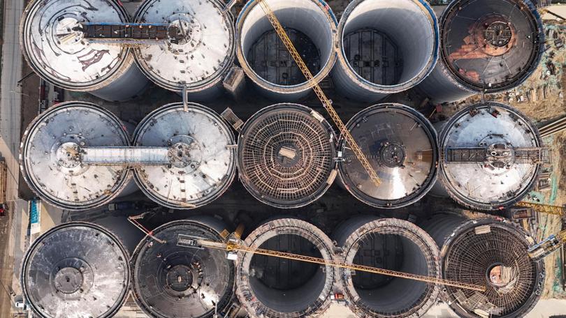 Workers on the Jiangsu Grain storage and logistics project in Huai'an, Jiangsu Province, China.