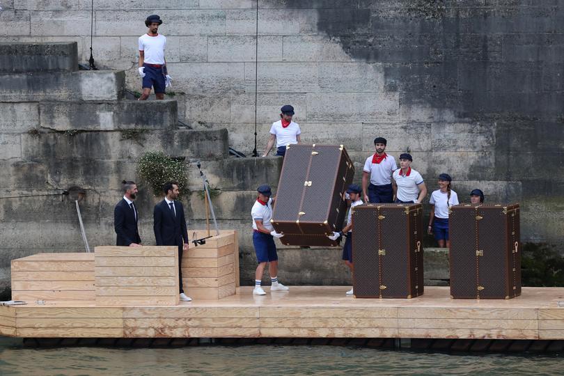 PARIS, FRANCE - JULY 26: Former athletes, USA's Michael Phelps (L) and France's Martin Fourcade (2nd-L), attend a show by the river Seine during the Opening Ceremony of the Olympic Games Paris 2024 on July 26, 2024 in Paris, France. (Photo by Jack Guez - Pool/Getty Images)