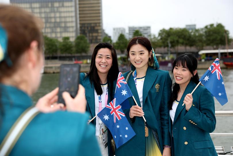 PARIS, FRANCE - JULY 26: Athletes of Team Australia are seen taking photos on the team boat during the opening ceremony of the Olympic Games Paris 2024 on July 26, 2024 in Paris, France. (Photo by Quinn Rooney/Getty Images)