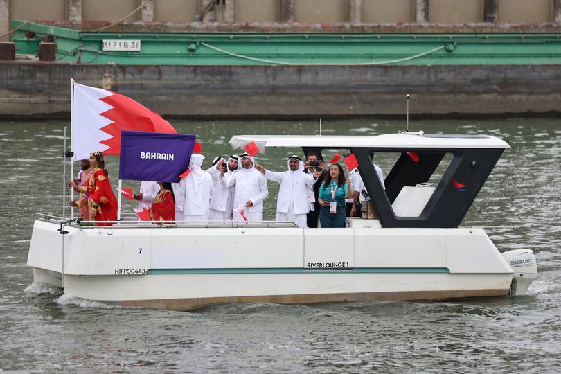 PARIS, FRANCE - JULY 26: Athletes of Team Bahrain wave flags during the opening ceremony of the Olympic Games Paris 2024 on July 26, 2024 in Paris, France. (Photo by Hannah Peters/Getty Images)