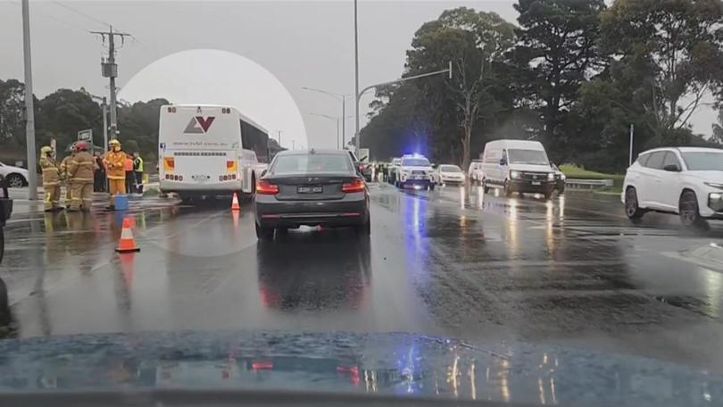 Two people are in hospital after a car collided with a school bus east of Melbourne. 