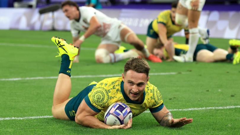 Corey Toole scores a try in Australia's 18-0 quarter-final win over the United States. (Iain McGregor/AAP PHOTOS)