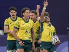 Australia’s rugby seven players celebrate after winning the quarter-final rugby against the USA.