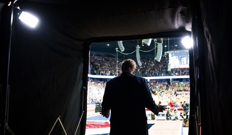 ]Former President Donald Trump takes the stage for a campaign rally at the Van Andel Arena in Grand Rapids, Mich., on Saturday, July 20, 2024.