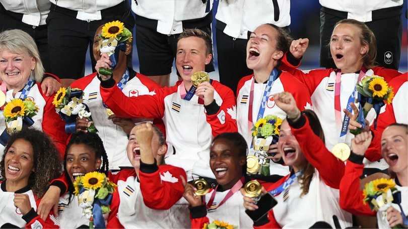 Canada’s Tokyo gold medal-winning coach Bev Priestman (middle) has been sent home from Paris 2024.