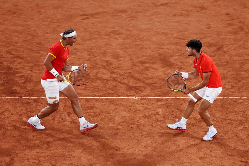 PARIS, FRANCE - JULY 27: Rafael Nadal (L) and partner Carlos Alcaraz of Team Spain celebrate against Andres Molteni and Maximo Gonzalez of Team Argentina during the Men's Doubles first round match on day one of the Olympic Games Paris 2024 at Roland Garros on July 27, 2024 in Paris, France. (Photo by Clive Brunskill/Getty Images)