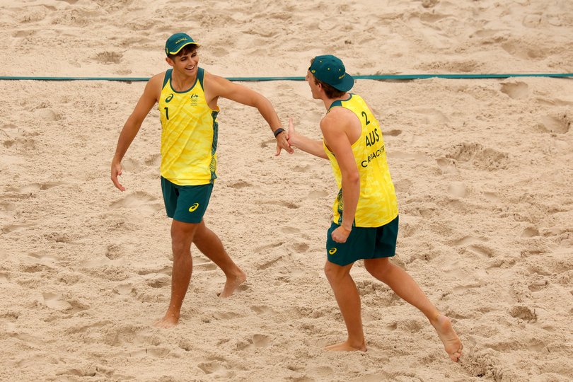 PARIS, FRANCE - JULY 27: Mark Nicolaidis and Izac Carracher of Team Australia celebrate during the Men's Preliminary Phase - Pool A match against Team Sweden on day one of the Olympic Games Paris 2024 at Eiffel Tower Stadium on July 27, 2024 in Paris, France. (Photo by Michael Reaves/Getty Images)