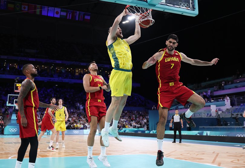 LILLE, FRANCE - JULY 27: Jock Landale #13 of Team Australia dunks the ball during the Men's Group Phase - Group A match between Australia and Spain on day one of the Olympic Games Paris 2024 at Pierre Mauroy Stadium on July 27, 2024 in Lille, France. (Photo by Gregory Shamus/Getty Images)