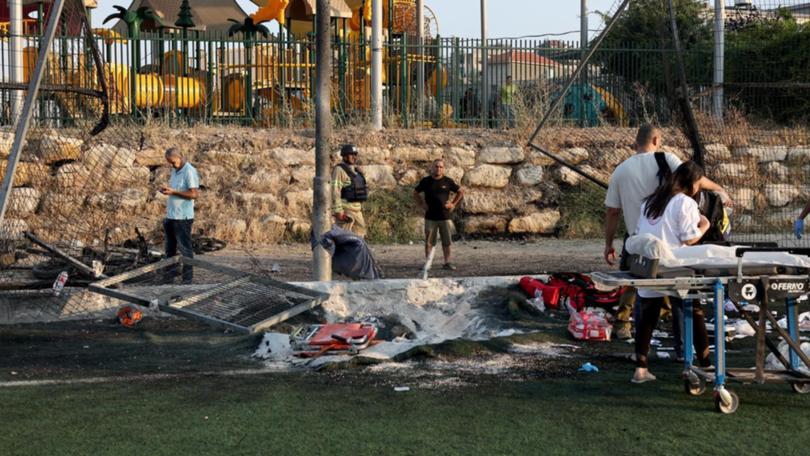 Ten people died after a Hezbollah rocket hit a football pitch in Israeli-occupied Golan Heights. (EPA PHOTO)