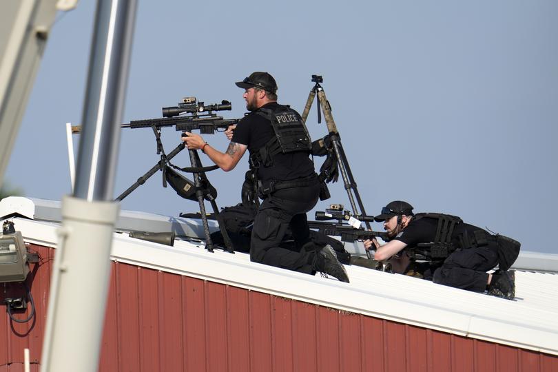 Police snipers return fire after shots were fired at  former President Donald Trump.