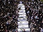 Mourners attend a funeral held for 10 of the victims of the rocket attack in Golan Heights.