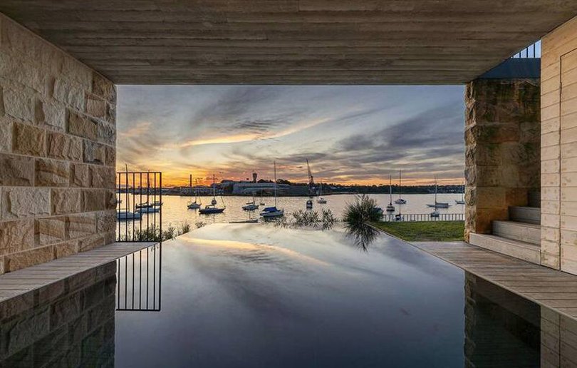 Swimming every morning looks like an attractive option at this harbourside home reinvented by Studio Prineas.