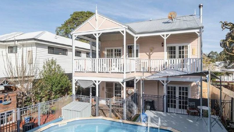 The Bulli home's north-facing verandah offers escarpment views while French doors open out to a covered entertaining area and large pool.