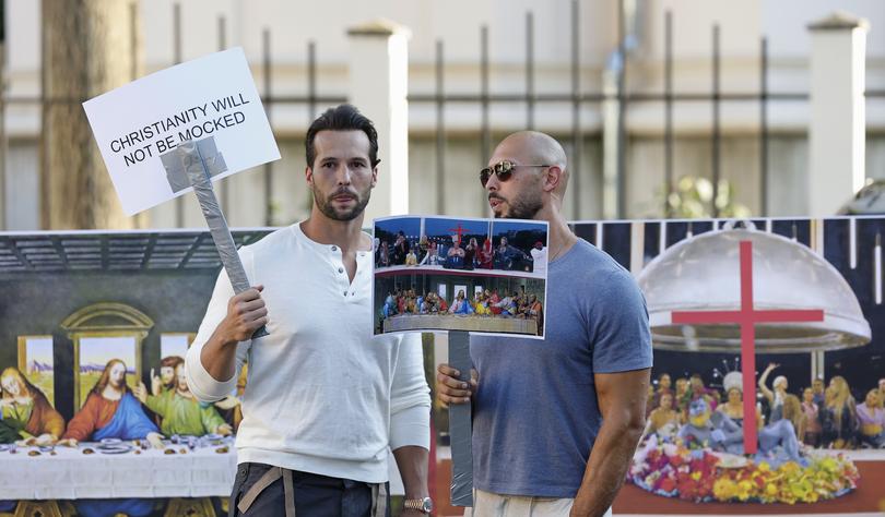 Influencer Andrew Tate, right, and his brother Tristan, left, protest the opening ceremony when The Last Supper was parodied.