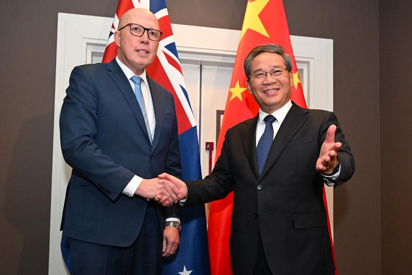 Chinese Premier Li Qiang shakes hands with Australian Opposition Leader Peter Dutton during a meeting at the Hyatt hotel in Canberra, Monday, June 17, 2024.