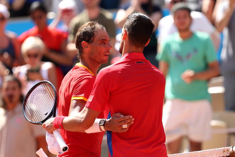 PARIS, FRANCE - JULY 29: Winner Novak Djokovic of Team Serbia (R) congratulates Rafael Nadal of Team Spain after the Men's Singles second round match on day three of the Olympic Games Paris 2024 at Roland Garros on July 29, 2024 in Paris, France. (Photo by Clive Brunskill/Getty Images)