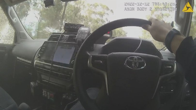 Body-worn footage shows Constable Randall Kirk entering a police car before the windows are shot multiple times.