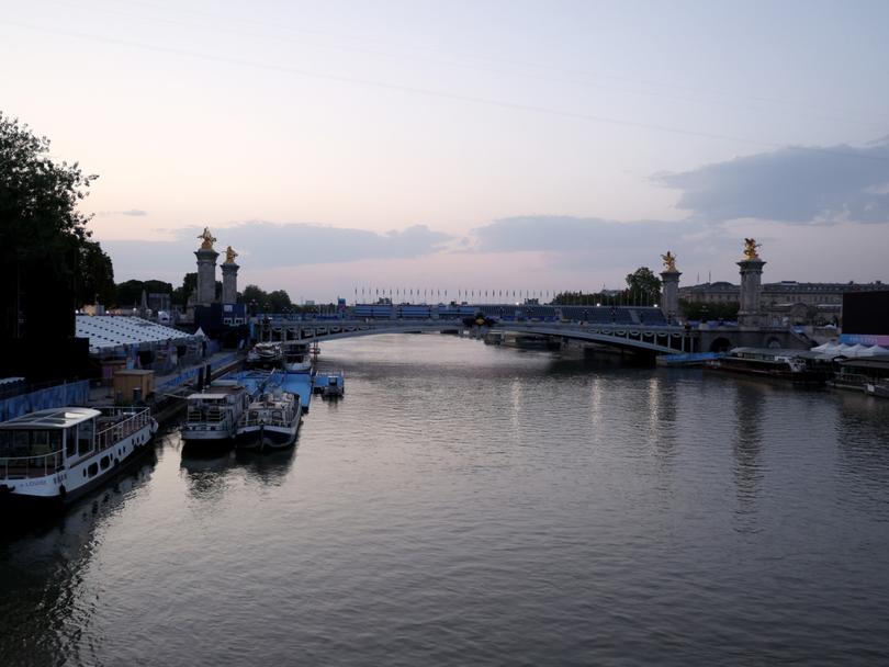 The Olympic women’s and men’s triathlon races will go ahead with swims in the Seine River on Wednesday after the water met quality standards, organisers say.