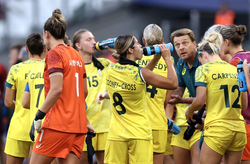 MARSEILLE, FRANCE - JULY 31: Kyra Cooney-Cross #8 of Team Australia and teammates take a water break during the Women's group B match between Australia and United States during the Olympic Games Paris 2024 at Stade de Marseille on July 31, 2024 in Marseille, France. (Photo by Alex Livesey/Getty Images)