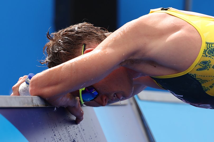 PARIS, FRANCE - JULY 31: Matthew Hauser of Team Australia reacts after crossing the finish line during Men's Individual Triathlon on day five of the Olympic Games Paris 2024 at Pont Alexandre III on July 31, 2024 in Paris, France. (Photo by Ezra Shaw/Getty Images)