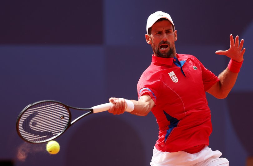 PARIS, FRANCE - JULY 31: Novak Djokovic of Team Serbia plays a forehand against Dominik Koepfer of Team Germany during the Men's Singles Third Round match on day five of the Olympic Games Paris 2024 at Roland Garros on July 31, 2024 in Paris, France. (Photo by Julian Finney/Getty Images)