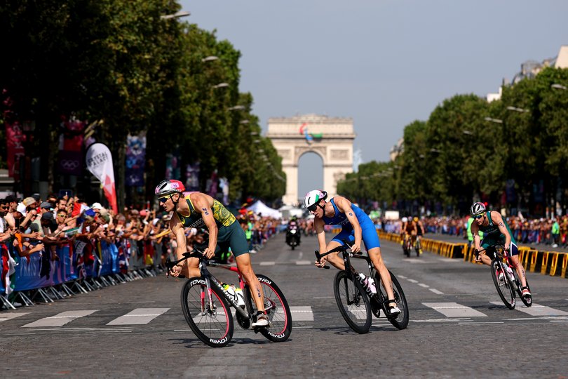 PARIS, FRANCE - JULY 31: Matthew Hauser of Team Australia and Alessio Crociani of Team Italy during Men's Individual Triathlon on day five of the Olympic Games Paris 2024 at Pont Alexandre III on July 31, 2024 in Paris, France. (Photo by Lars Baron/Getty Images)