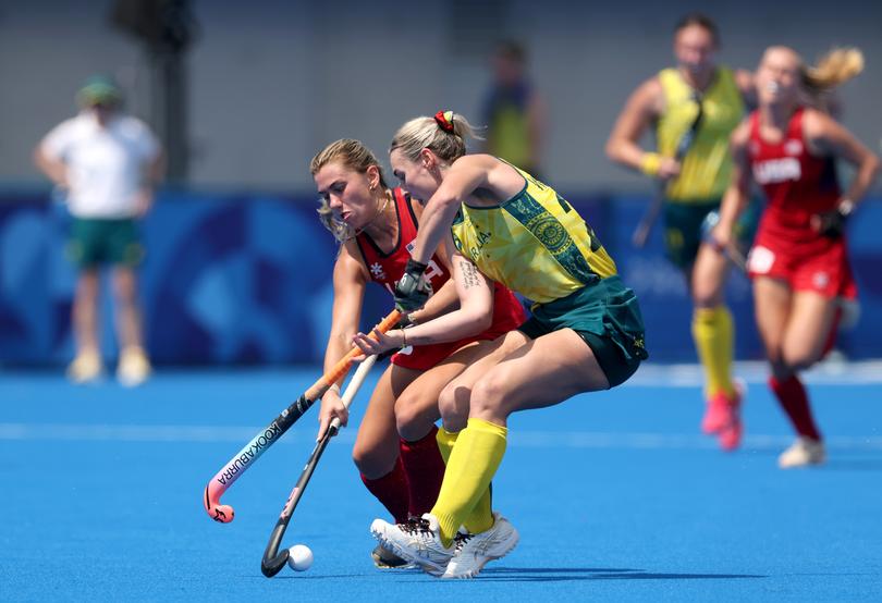 PARIS, FRANCE - JULY 31: Ashley Sessa of Team United States battles for possession with Mariah Williams of Team Australia during the Women's Pool A match between France and Germany on day five of the Olympic Games Paris 2024 at Stade Yves Du Manoir on July 31, 2024 in Paris, France. (Photo by Michael Reaves/Getty Images)