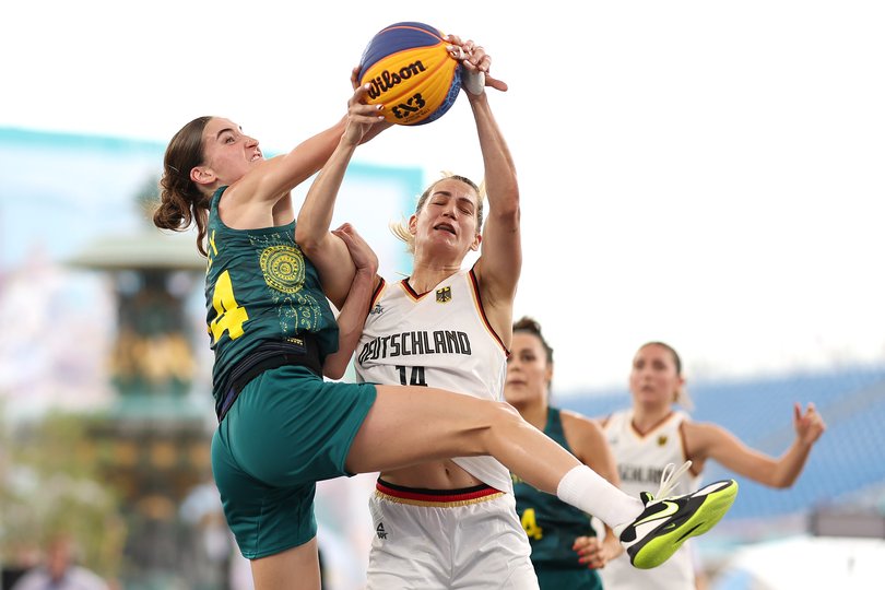 PARIS, FRANCE - JULY 31: Anneli Maley #24 of Team Australia and Sonja Greinacher #14 of Team Germany fight for a rebound during a Women's Pool Round match on day five of the Olympic Games Paris 2024 at Esplanade Des Invalides on July 31, 2024 in Paris, France. (Photo by Ezra Shaw/Getty Images)