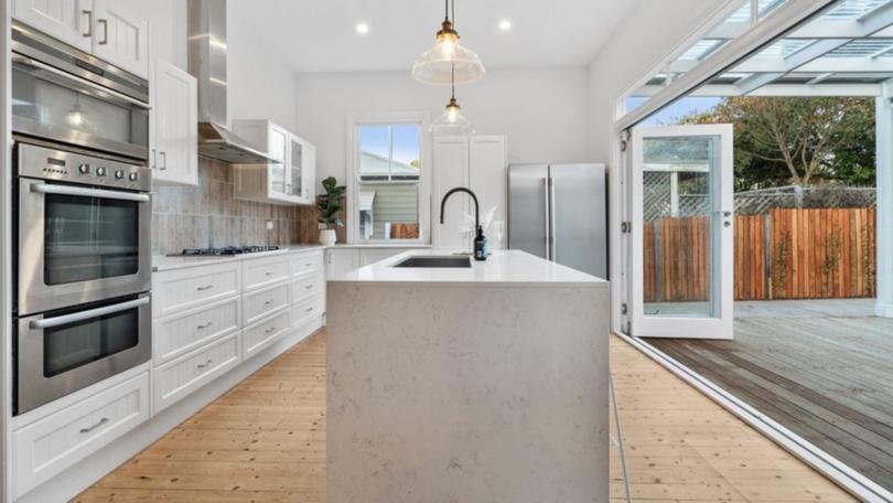 The open-plan kitchen and living area at the rear.