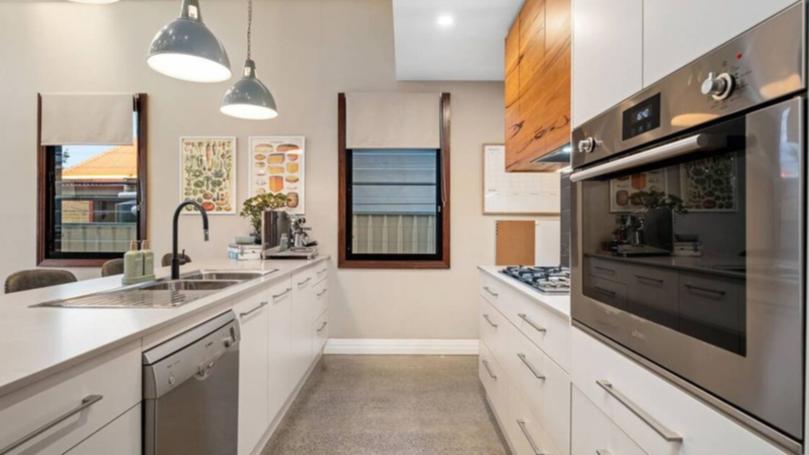 The kitchen has a large island bench.