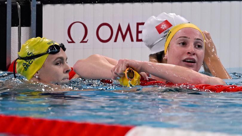 Australian swimmers Shayna Jack (left) and Mollie O'Callaghan (right) react after the 100m freestyle final.